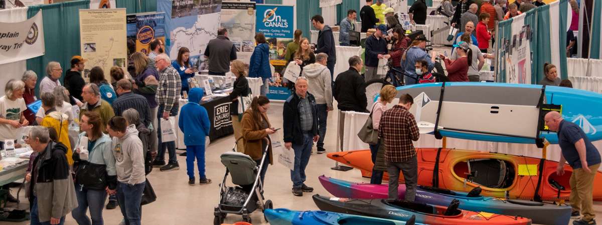 people exploring an indoor sports expo