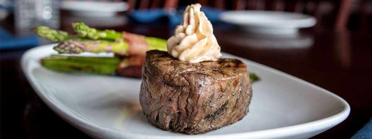 steak with butter on it
