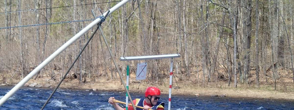 canoer going through a gate