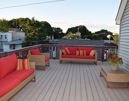 huge deck with red furniture