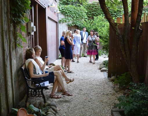 people sitting by a walkway
