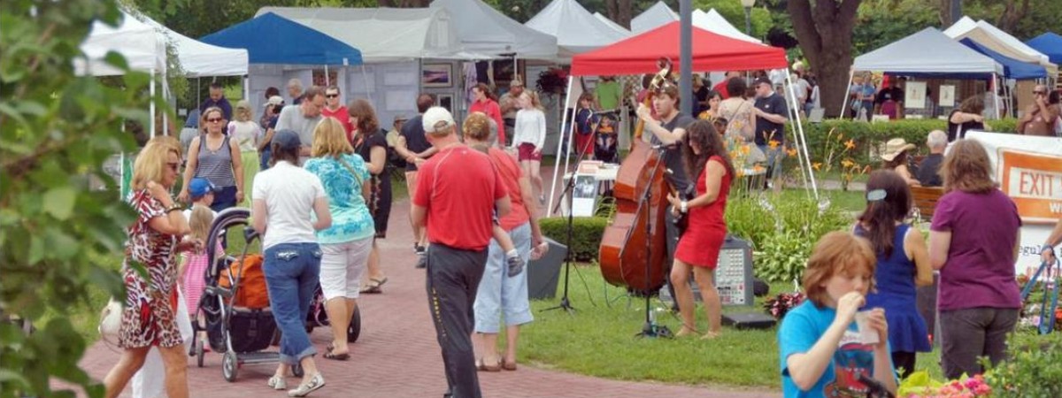 art in the park tents and people in congress park