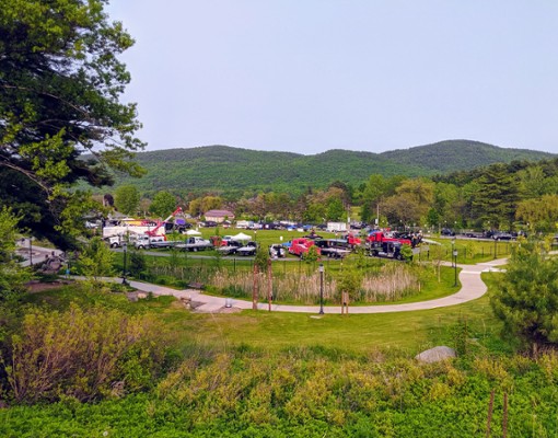 view of trucks in park from far away
