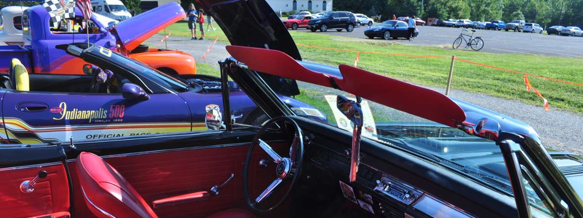 inside of a classic car, red