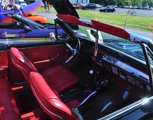 inside of a classic car, red