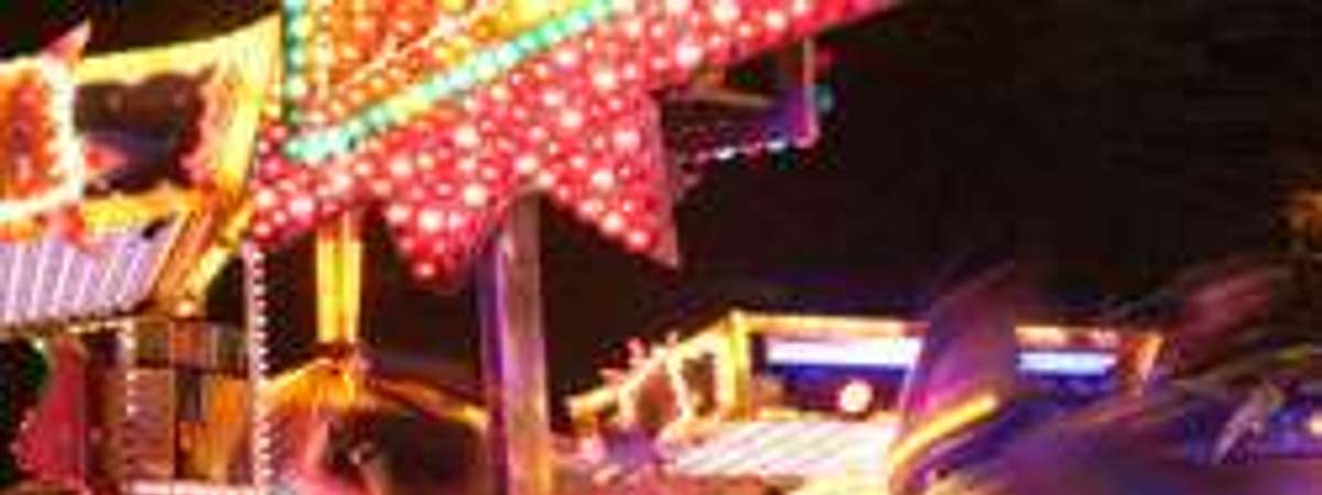 blurry photo of a ride at the fair