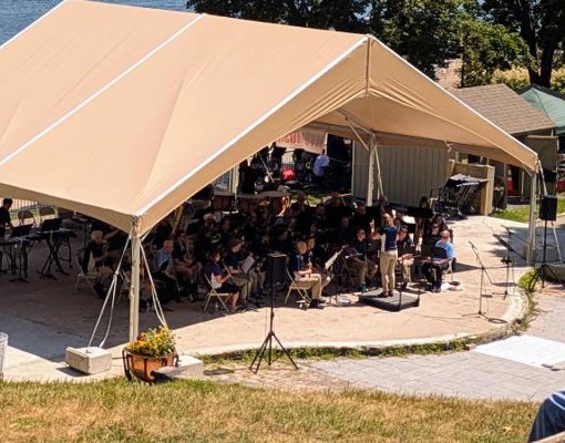 community band plays with beach in background