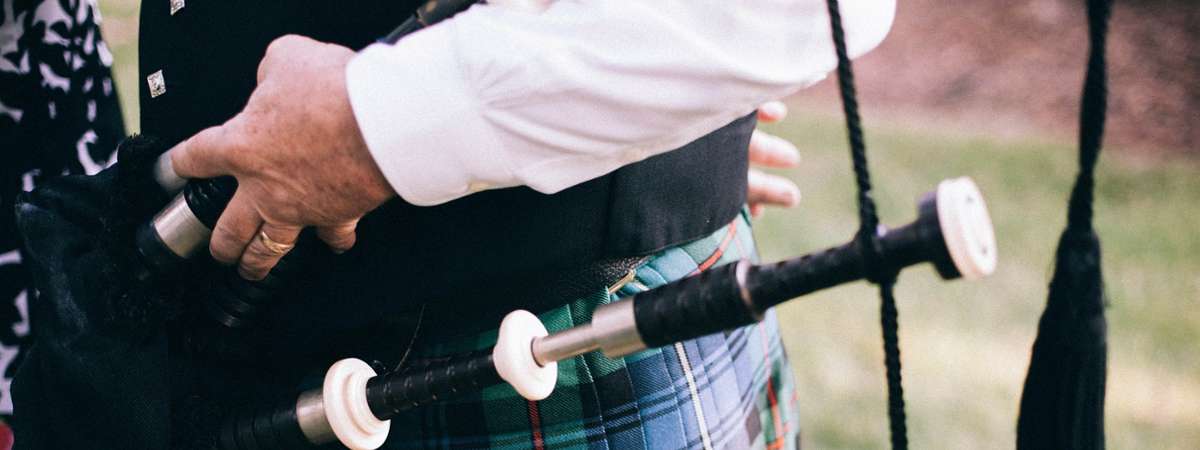 close up of bagpipes on a person