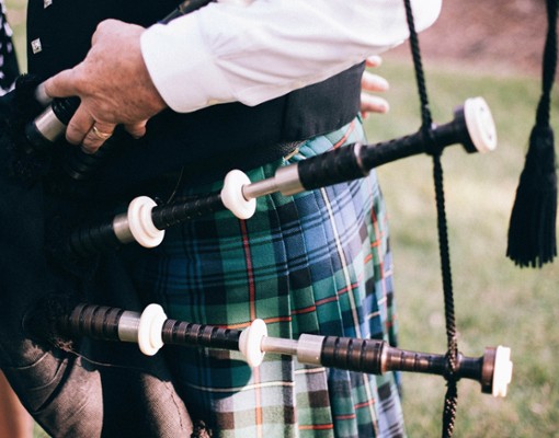 close up of bagpipes on a person