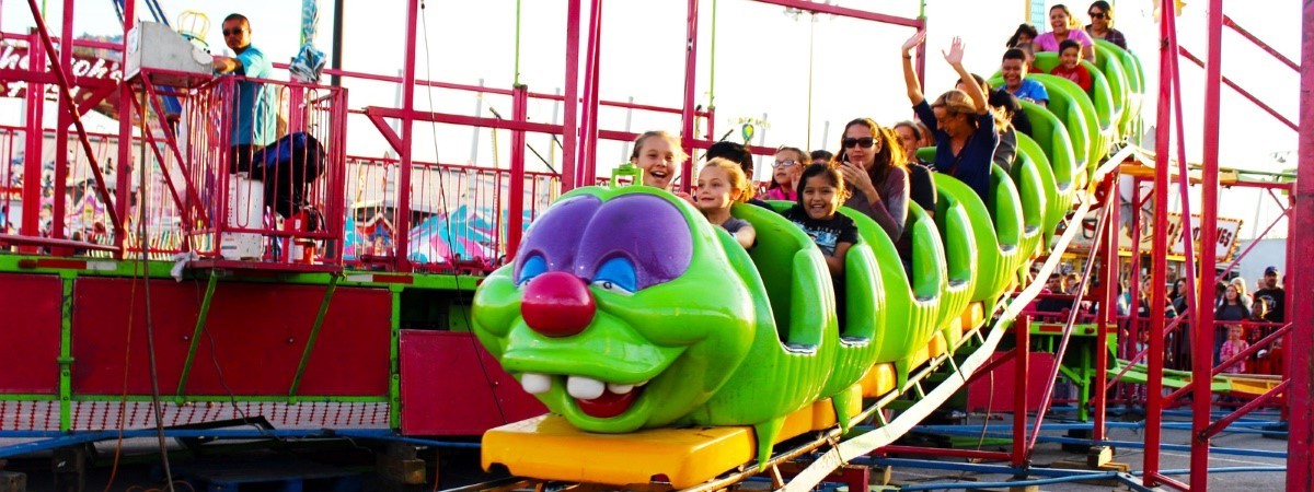 The fair's midway features rides for the whole family like the Wacky Worm rollercoaster.