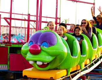 The fair's midway features rides for the whole family like the Wacky Worm rollercoaster.