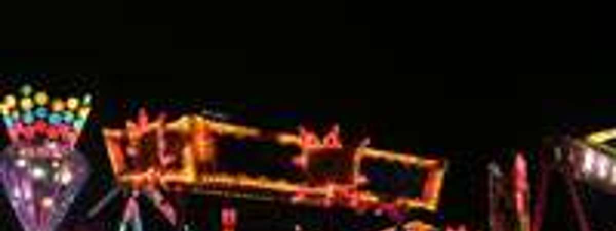 blurry image of lights at night at the fair
