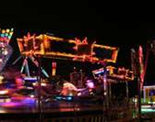 blurry image of lights at night at the fair