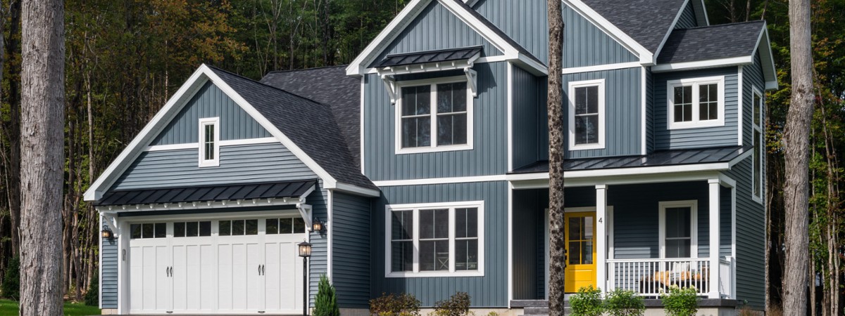grayish-blue house with white garage
