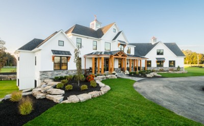 White home with wooden patio 
