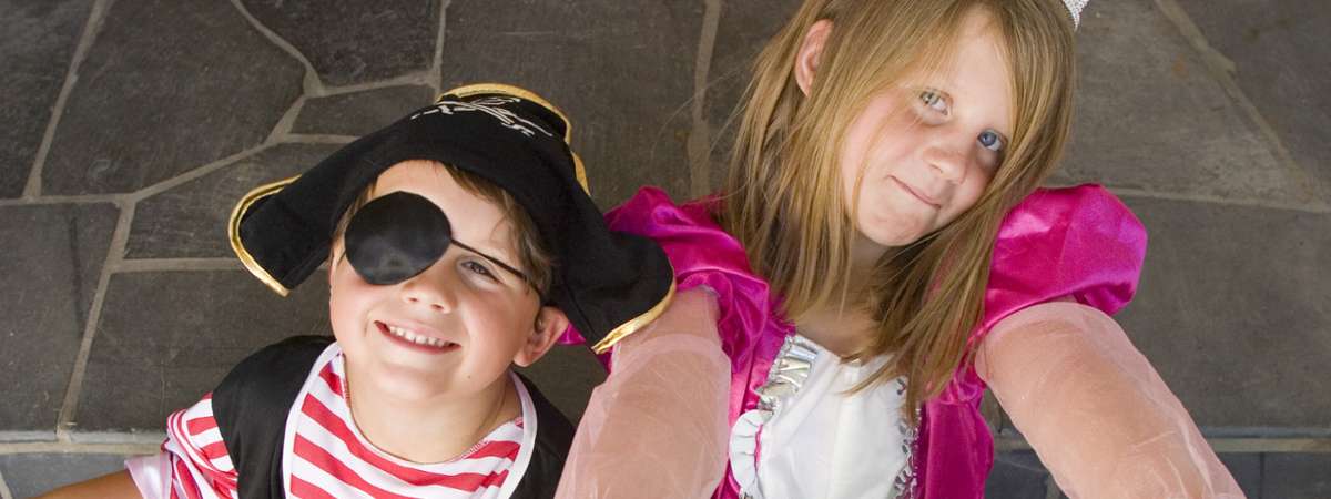 two costumed kids - boy pirate and girl princess