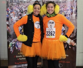 two women in festive turkey troy outfits