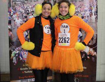 two women in festive turkey troy outfits