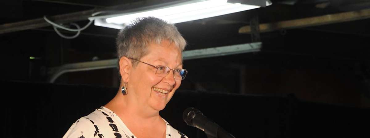 woman speaking at podium