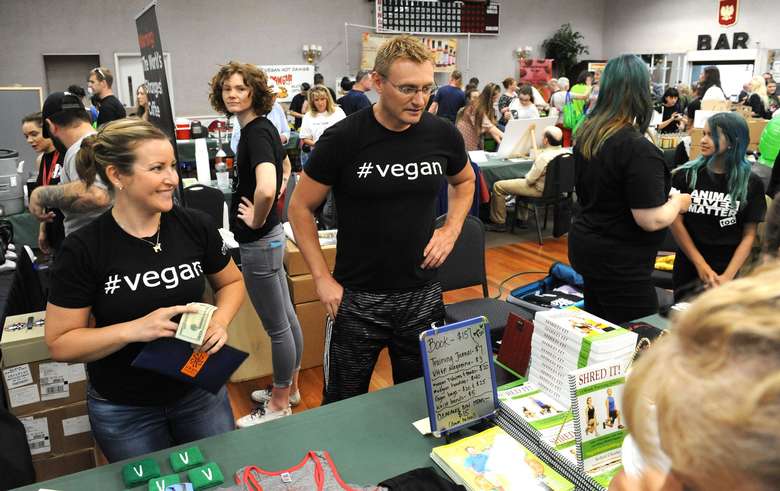 people with tee-shirts with #vegan