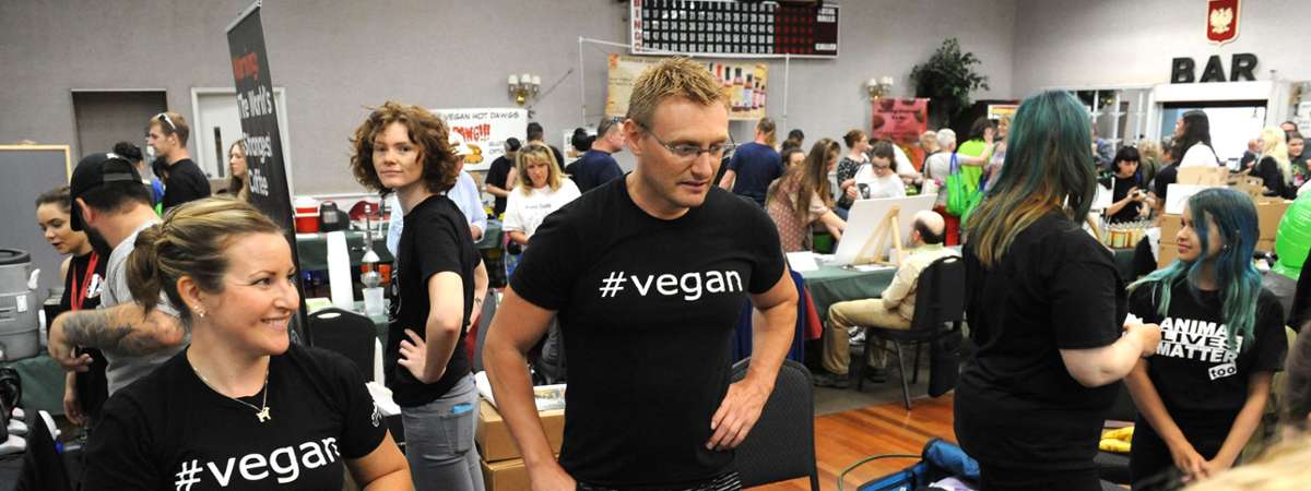 people with tee-shirts with #vegan