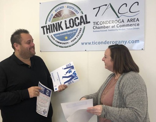 two people holding flyers