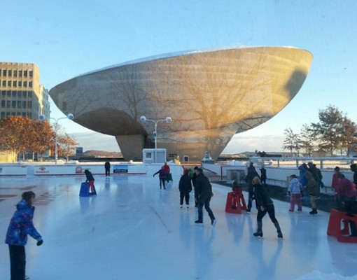 people skating with The Egg in the background