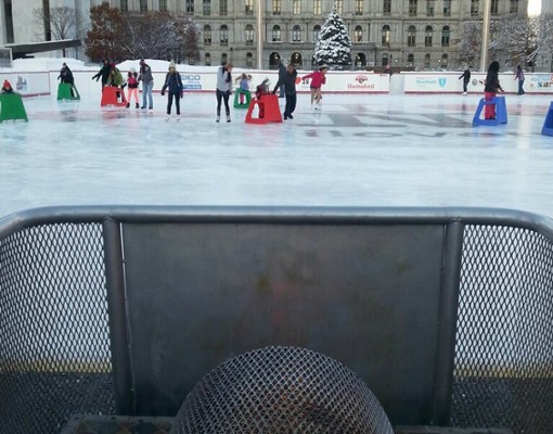 people skating in front of the plaza
