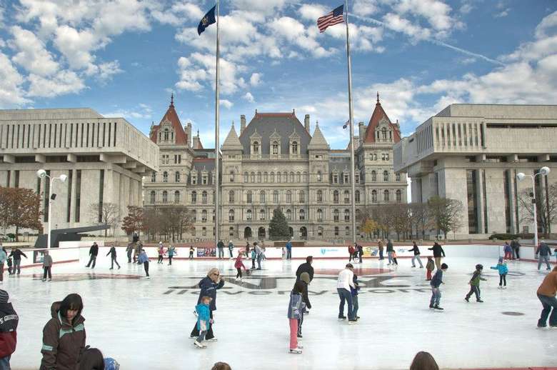 people skating in front of the capitol building