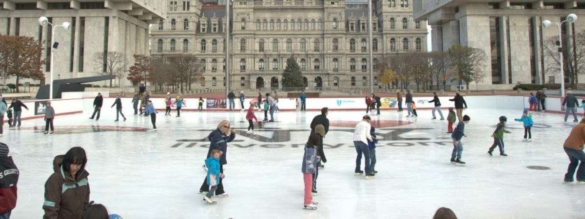 people skating in front of the capitol building