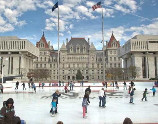 people skating in front of the capitol building