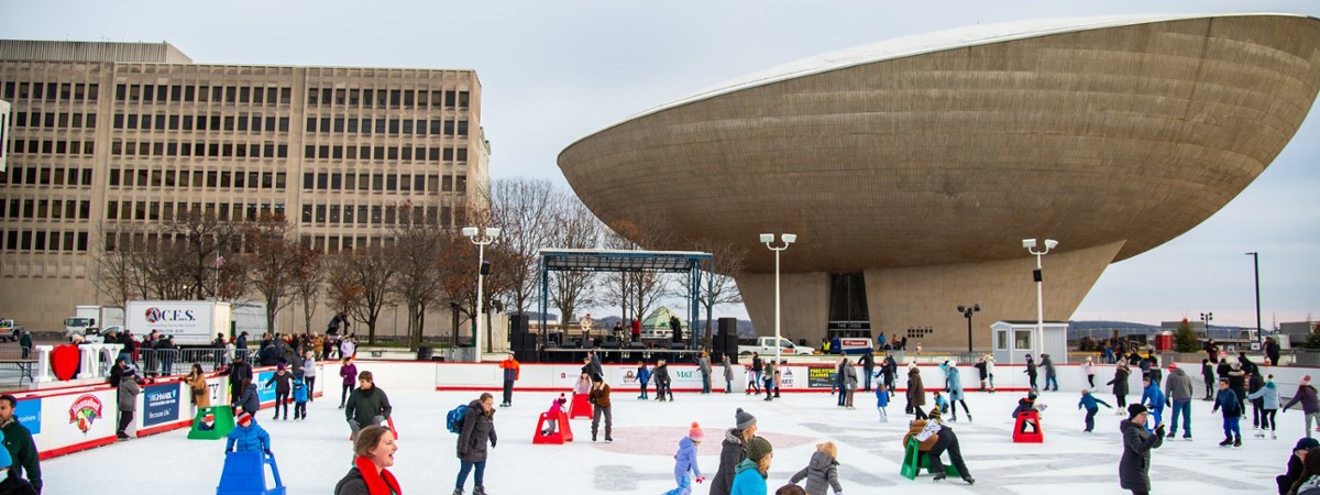 people skating with the egg in the background