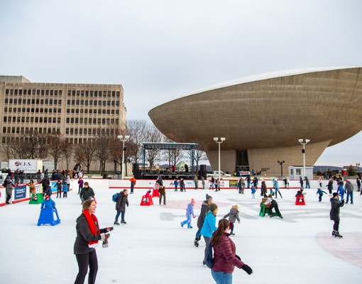 people skating with the egg in the background