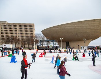 people skating with the egg in the background