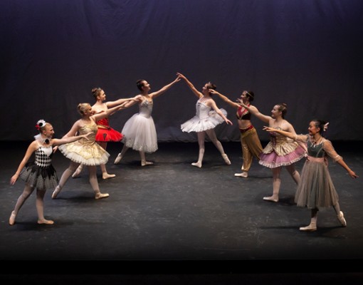 group of dancers posing in costume