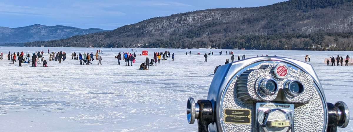 viewfinder looking at people on ice at lake george winter carnival