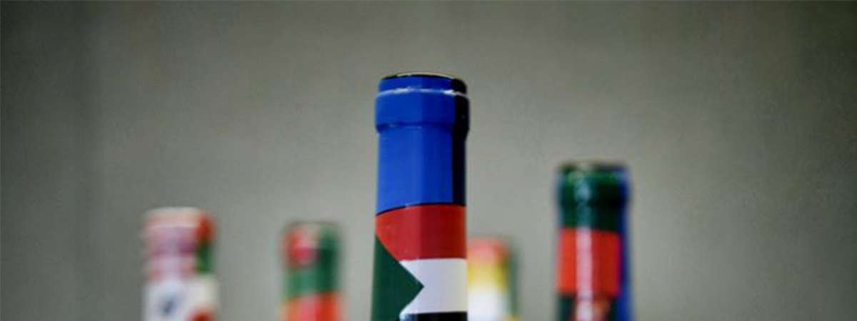 wine bottles with international flags on them