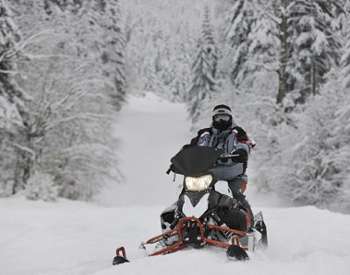 snowmobile rider in the snow