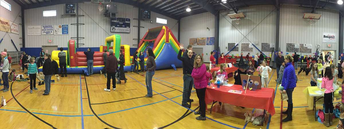 wide view of a carnival in a gym