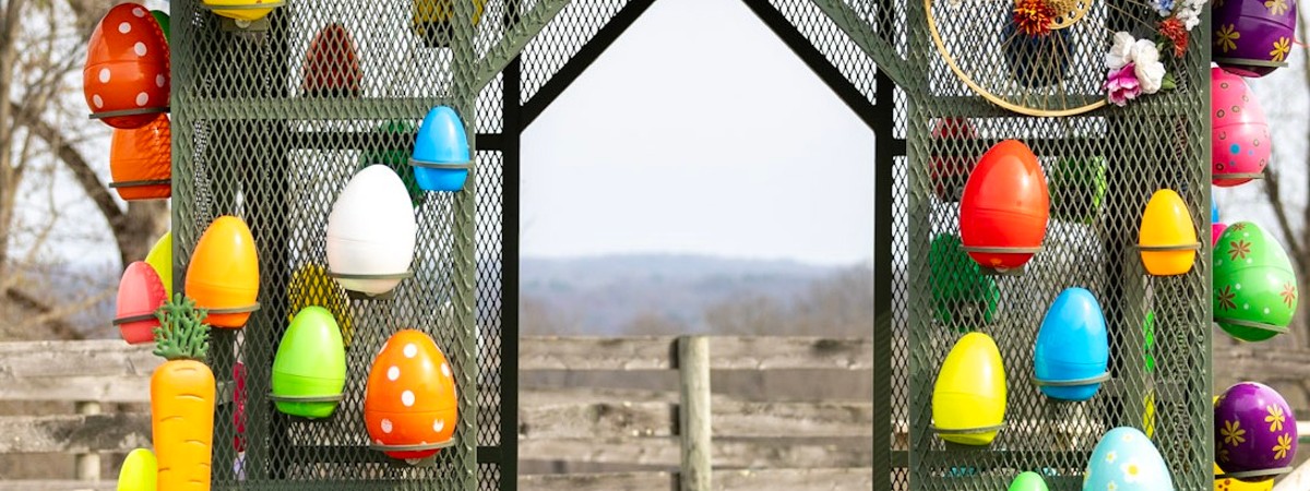 a decorated barn building with Easter eggs
