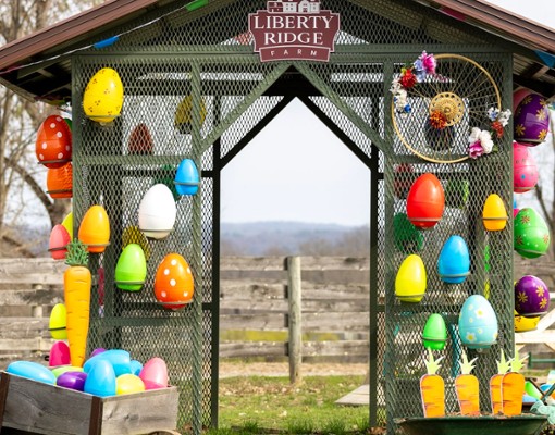 a decorated barn building with Easter eggs