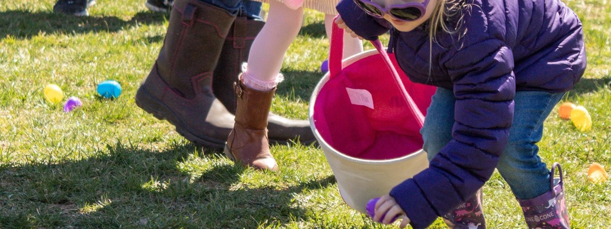 girl searching for Easter eggs