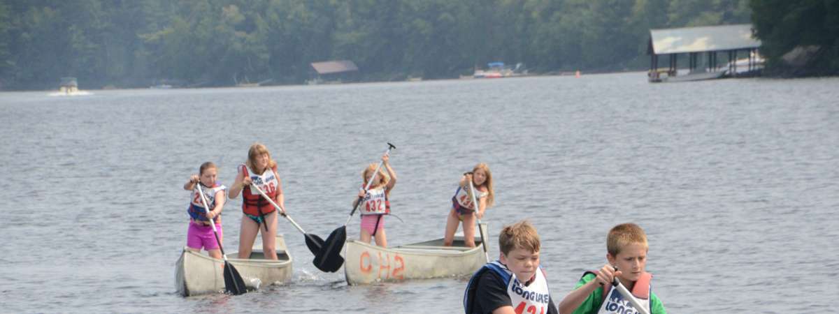 people paddling on lake
