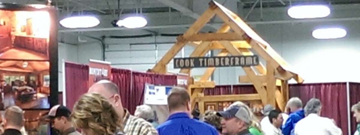 people at a log home expo