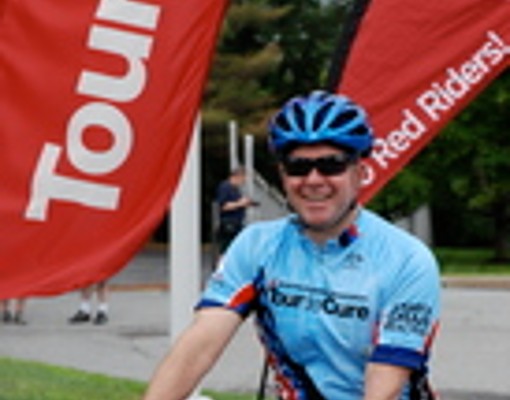 a smiling bicyclist