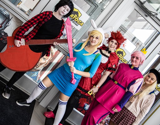five people dressed up at comic con