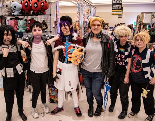 six people dressed up at comic con