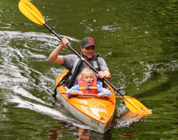 dad and daughter kayaking together