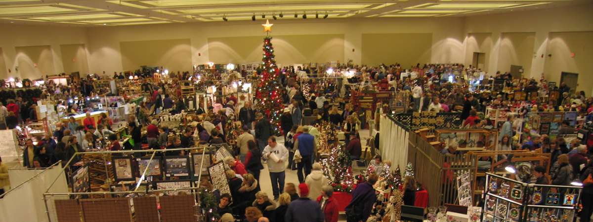 large crowd at a holiday marketplace
