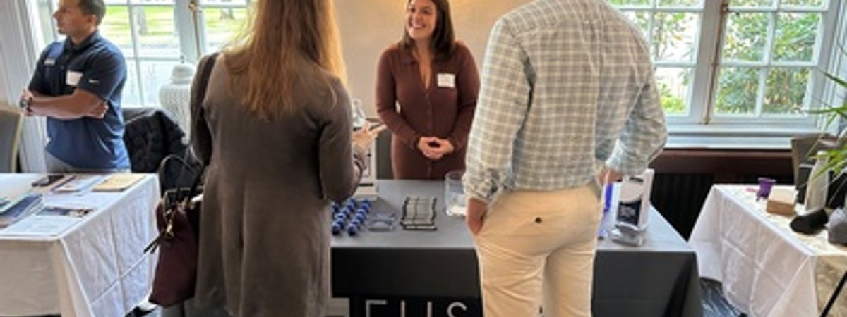 people at a business booth